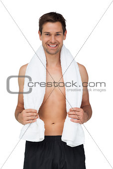 Portrait of a smiling shirtless man with towel