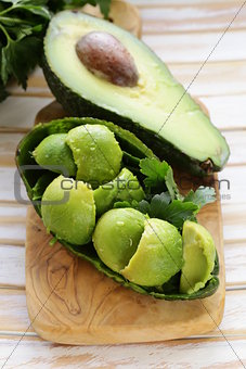salad of fresh avocado on a wooden board