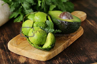 salad of fresh avocado on a wooden board