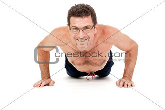 adult smiling man doing workout pushups isolated