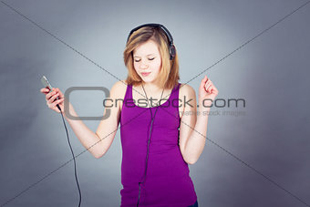 dancing happy teenage girl listening to music 