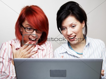 Two businesswomen are very surprised