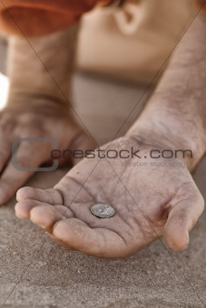 Beggar hand with coin