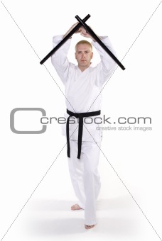 First Degree Black Belt with tonfa.