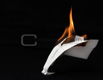Paper airplane in flames 