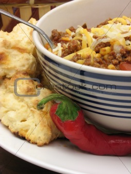 Chili with biscuits and a pepper