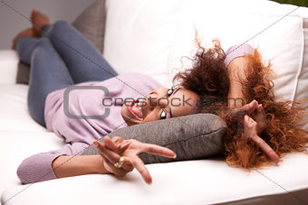 beautiful young black happy woman on a sofa