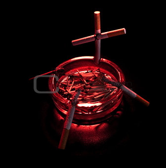 cigarette cross in ashtray