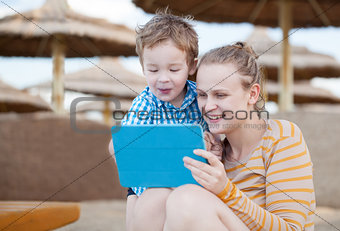 Happy mother and son at a beach resort