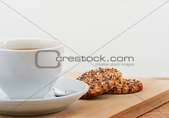 Cup of black coffee with butter biscuit