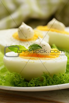 appetizer of boiled eggs with mayonnaise and spices
