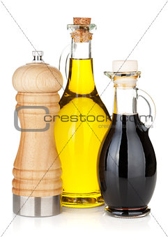 Olive oil and vinegar bottles with pepper shaker