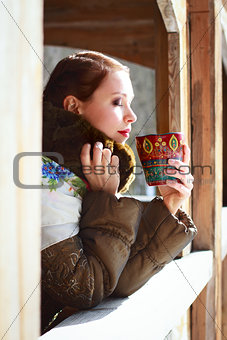 Russian woman in a scarf and coat