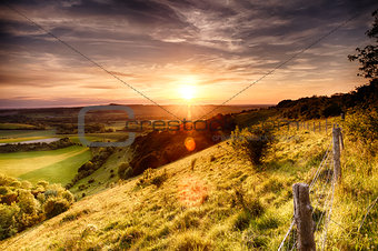 Hill fence sunset