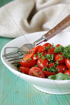 salad of small cherry tomatoes with parsley and olive oil