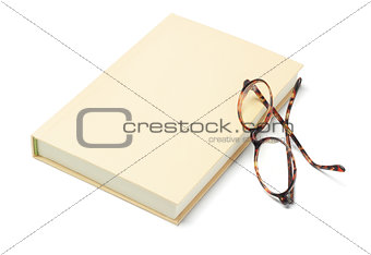 Hardcover Book and Reading Glasses