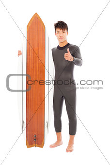 surfer man holding a surfboard and thumb up