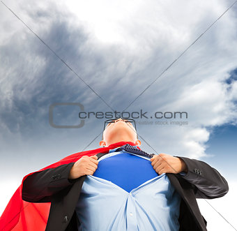 Businessman imitate superman to pull his t-shirt open 