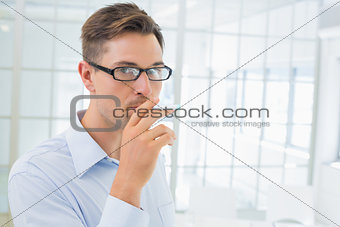 Casual businessman smoking an electronic cigarette