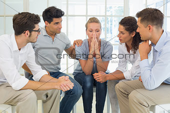 Group therapy in session sitting in a circle