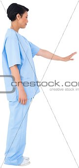 Pretty dark haired surgeon gesturing