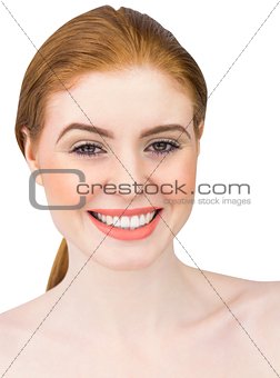 Beautiful redhead smiling at camera