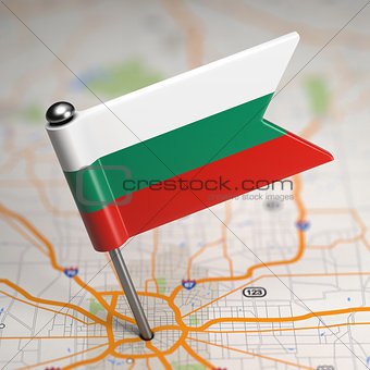 Bulgaria Small Flag on a Map Background.
