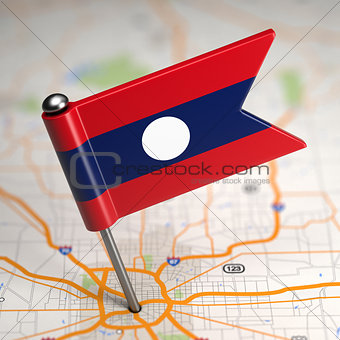 Laos Small Flag on a Map Background.