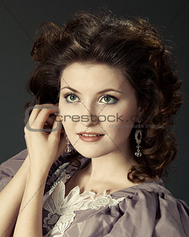 Woman lilac dress on  gray background 