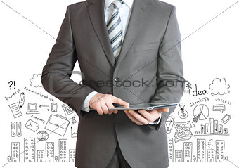 Man with tablet in hands and business sketches