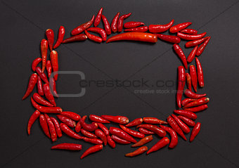 Frame made of non-stem red bird eye chili peppers 