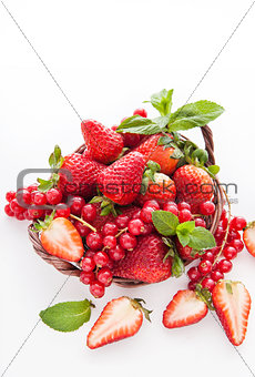 Fresh strawberry and redcurrant on white