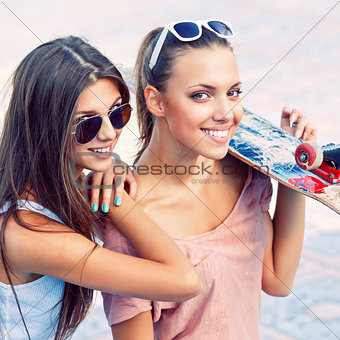 two beautiful young girls in sunglasses