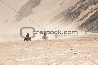 Quad bike safari through a desert landscape