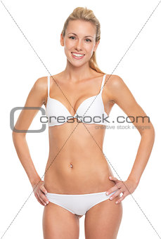 Portrait of smiling young woman in lingerie