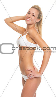 Portrait of happy young woman in lingerie