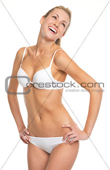 Portrait of laughing young woman in lingerie