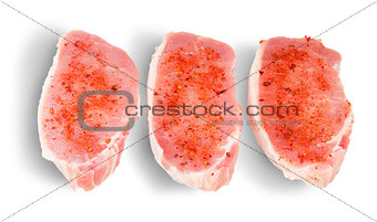 Three Pieces Of Raw Pork With Spices