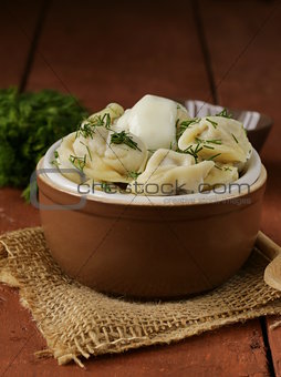 traditional Russian dumplings served with dill and sour cream