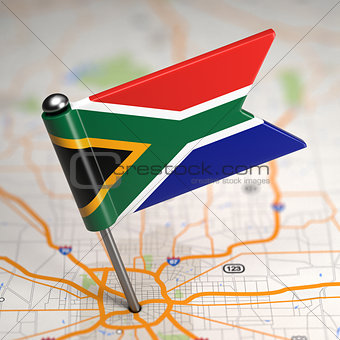 South Africa Small Flag on a Map Background.