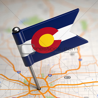 Colorado Small Flag on a Map Background.