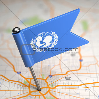 UNICEF Small Flag on a Map Background.