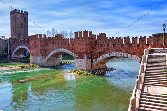 Famous red brick Castelvecchio bridge across Adige river in Verona, Italy.