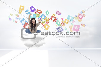 Composite image of woman looks straight ahead as she celebrates in front of her laptop