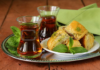 traditional Turkish arabic dessert - baklava with honey and pistachios
