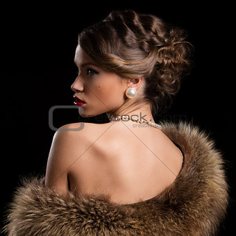 Retro. Beautiful, attractive woman wearing fur