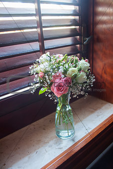 Flowers bouquet on windowsill