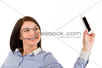 young smiling brunette woman taking a selfie