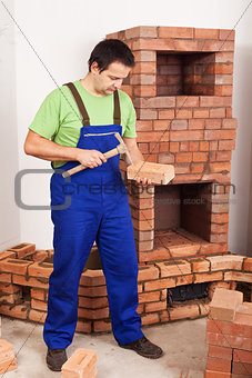 Man building masonry heater