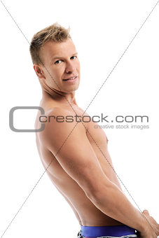 Adult man without shirt posing in studio